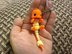 Articulated Charmander Keychain — source reference photo, not owned inventory